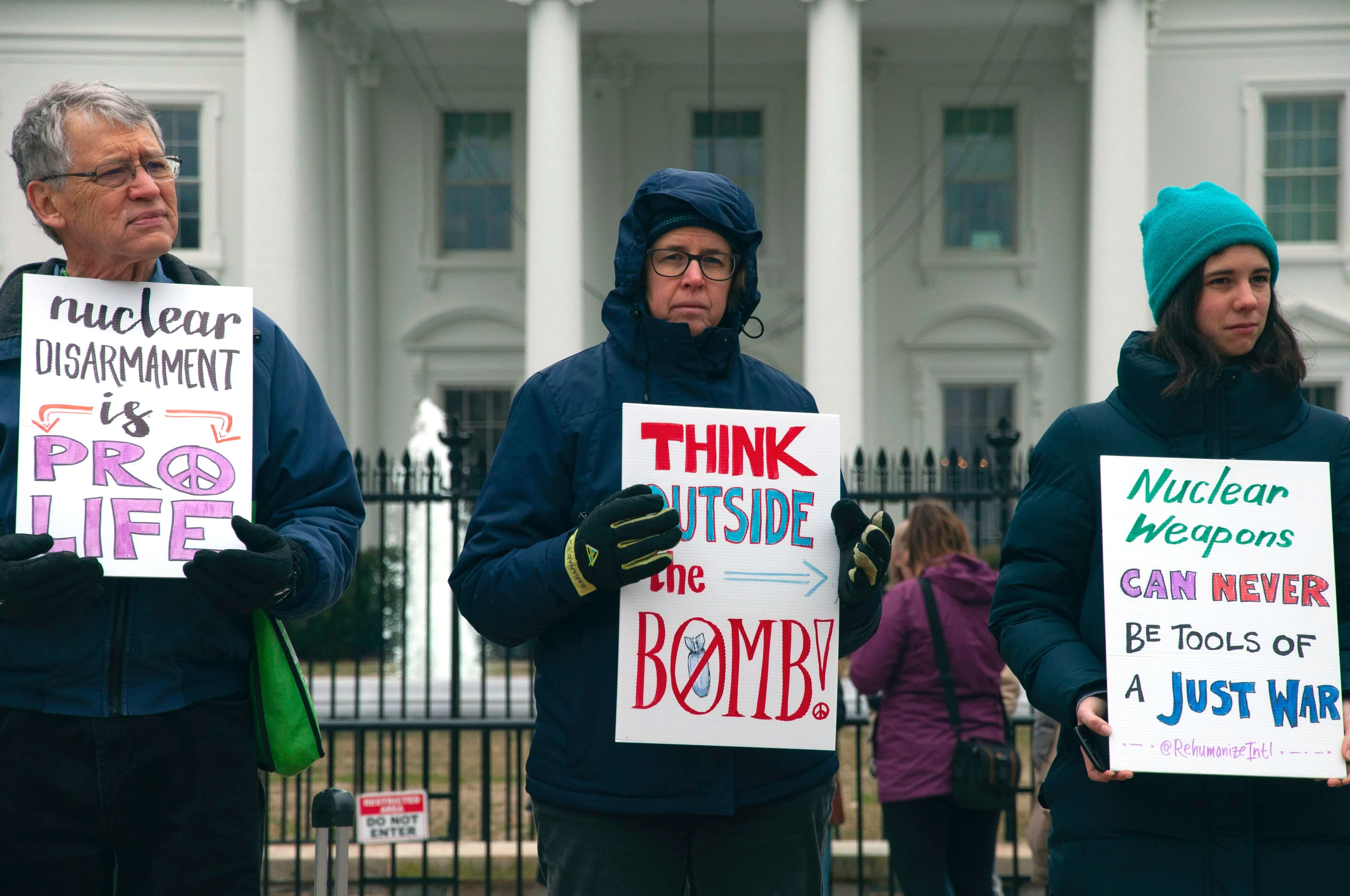 three protestors in front of white house demanding ban the bomb